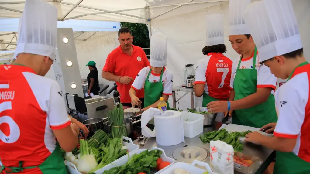 A rugby team from the Pontlevoy Rugby Heritage Cup makes a typical local dish