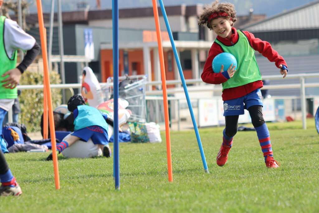 A young rugby player in rugby training
